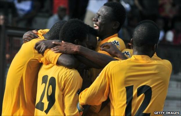 Asec Mimosas players celebrate earlier in 2011