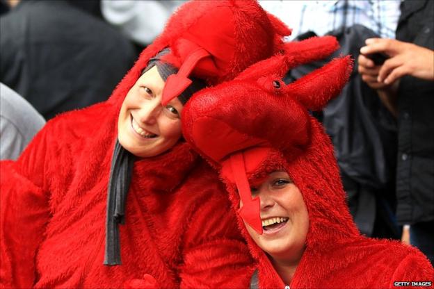Swansea fans dressed as dragons