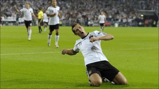 Miroslav Klose of Germany celebrates his team's first goal during