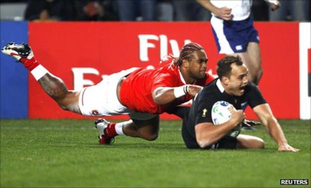 Israel Dagg, who collected two tries, dives over to score for New Zealand