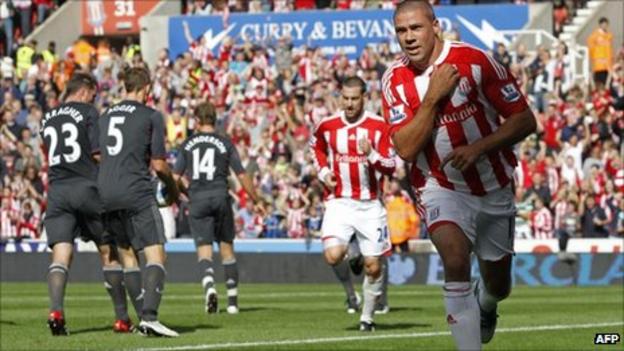 Jonathan Walters celebrates his penalty against Liverpool