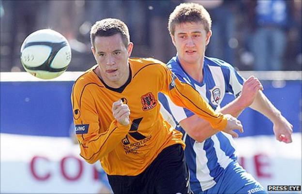 Carrick's Chris Murray in action against Shane Jennings of Coleraine