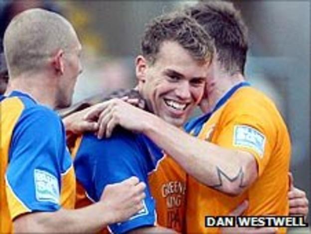 Mansfield players celebrate another goal in the win over Newport