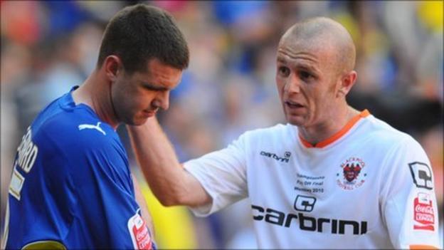 Cardiff City's Anthony Gerrard is consoled by Blackpool's Stephen Crainey at the end of the play-off final