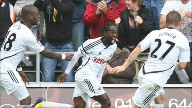 Nathan Dyer celebrates after scoring Swansea City's third goal against West Brom