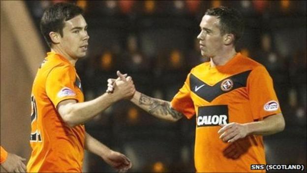 Ryan Dow (l) is congratulated on his goal by Danny Swanson
