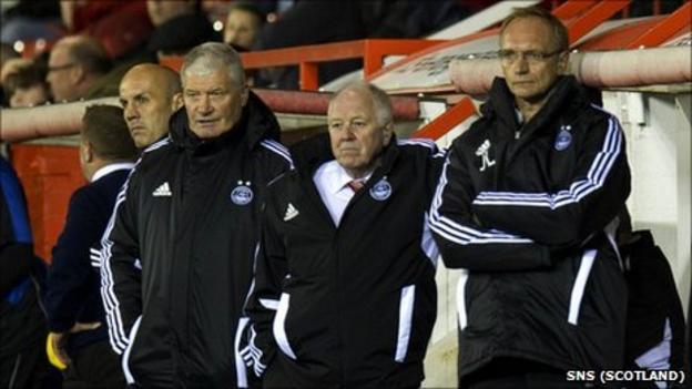 Aberdeen boss Craig Brown (middle) has vowed to continue at Pittodrie
