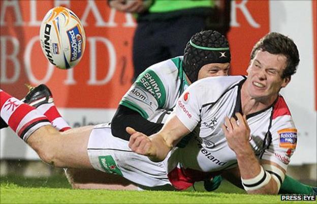 Kristopher Burton of Treviso tackles Ulster's Ian Whitten at Ravenhill