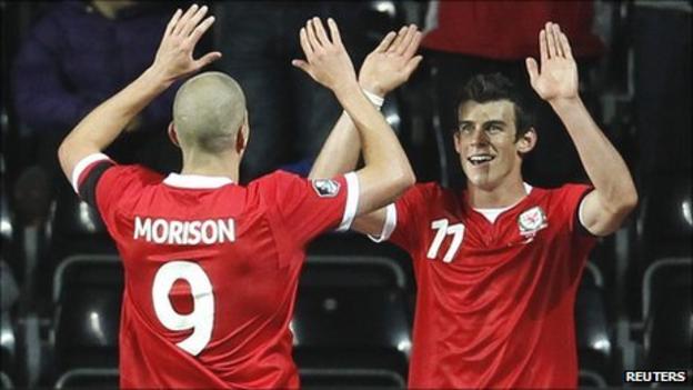 Wales striker Steve Morison congratulates goal-scorer Gareth Bale