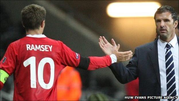 Wales manager Gary Speed congratulates captain Aaron Ramsey