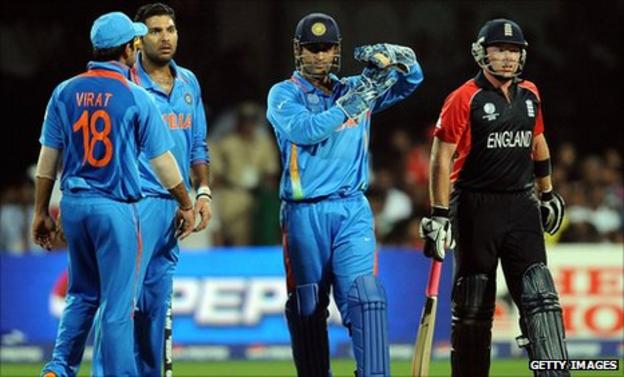 India captain Mahendra Dhoni (centre) calls for a review against England's Ian Bell (right) at the World Cup