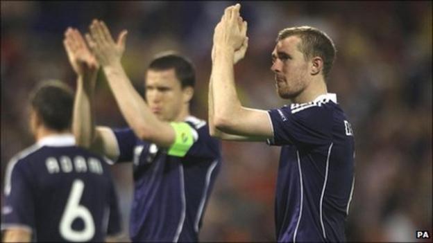 Darren Fletcher (right) and Gary Caldwell (centre) applaud the travelling Scotland fans