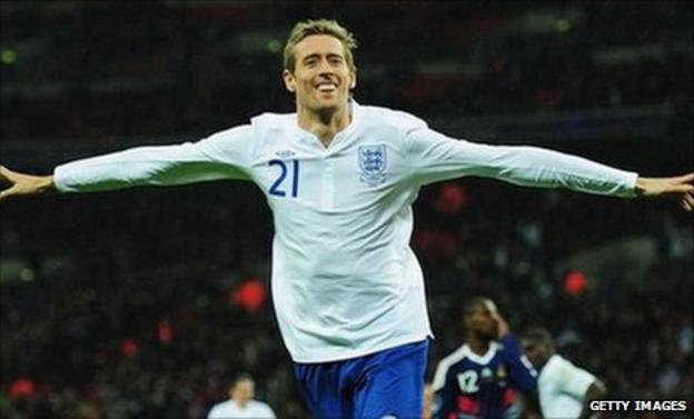 Peter Crouch celebrates his goal for England against France in November 2010