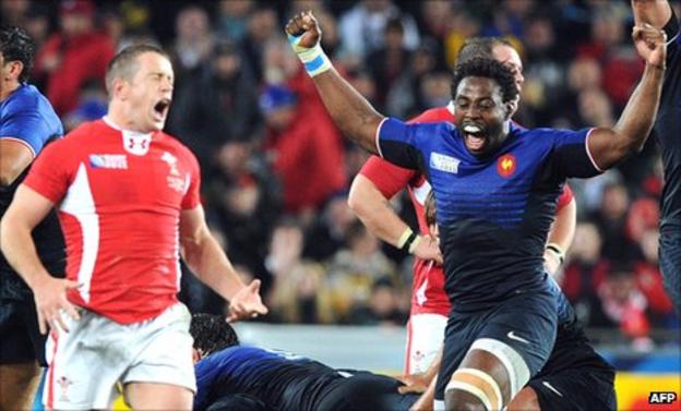 Wales winger Shane Williams despairs as France back rower Fulgence Ouedraogo celebrates the final whistle