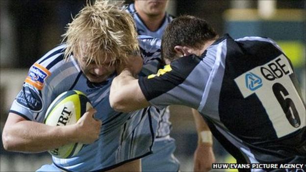 Cardiff Blues' Luke Hamilton is tackled by Mark Wilson of Newcastle