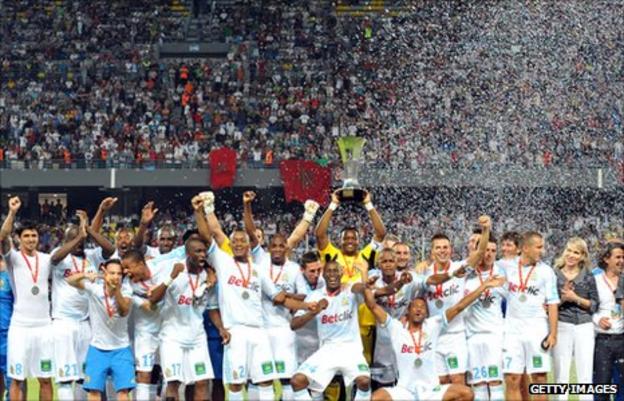 Marseille players celebrate winning the Champions Trophy in July
