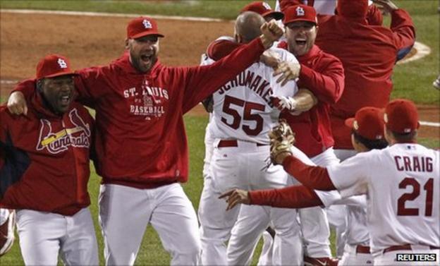 Winning pitcher Chris Carpenter (second left) joins in the celebrations