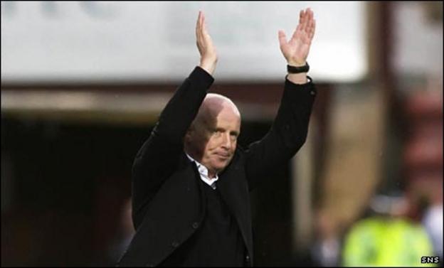 Peter Houston applauds his players