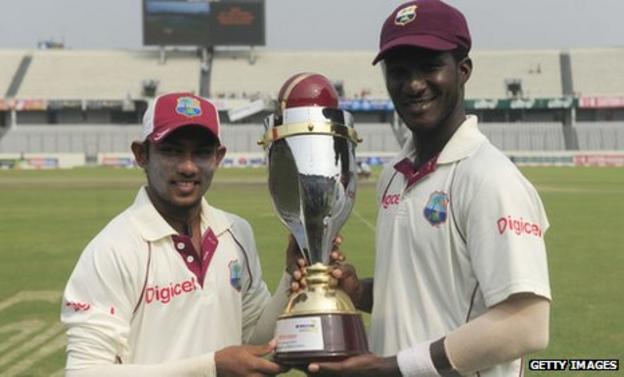 West Indies spinner Devendra Bishoo and captain Darren Sammy with the Test series trophy