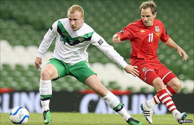 Liam Boyce in action for Northern Ireland against David Vaughan of Wales