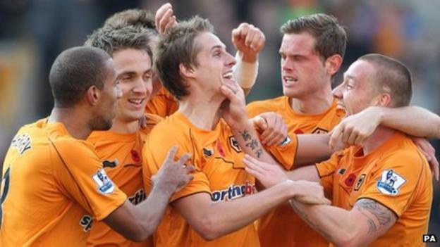 Wolves players congratulate David Edwards (centre) on his goal