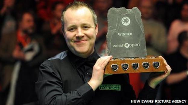 John Higgins celebrates after winning the final of the 2011 Welsh Open