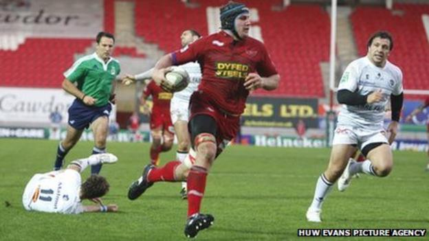 Scarlets back-row Ben Morgan breaks through the Castres defence to score