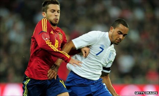 England winger Theo Walcott takes on Jordi Alba of Spain in the friendly at Wembley