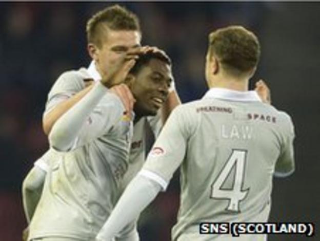 Omar Daley celebrates with his team-mates after scoring Motherwell's winner against Aberdeen