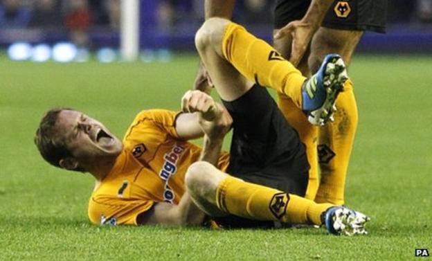 Wolves defender Richard Stearman writhes in agony after suffering an injury