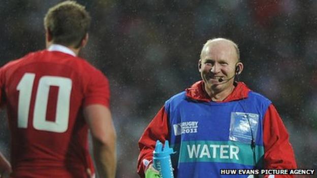Neil Jenkins offers water and advice to Wales fly-half Rhys Priestland