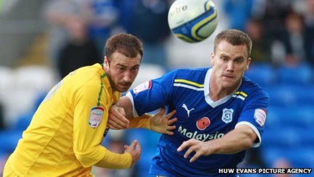 Cardiff defender Ben Turner and Crystal Palace's Glenn Murray compete for the cball