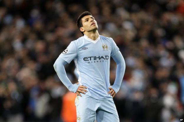 Sergio Aguero looks to the sky as his side go out of the Champions League