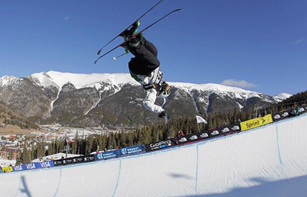 A freestyle skier in action in a half-pipe World Cup competition