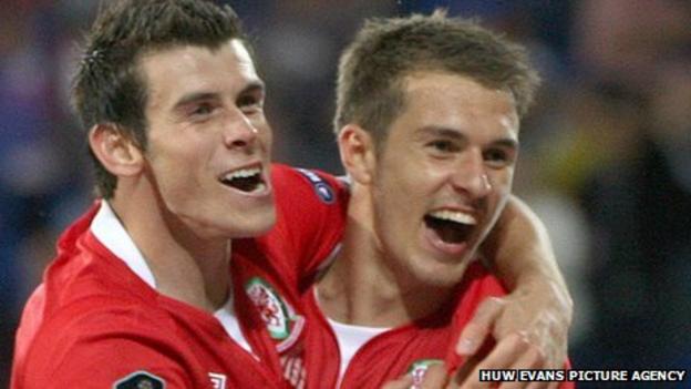Gareth Bale and Aaron Ramsey celebrate victory over Montenegro