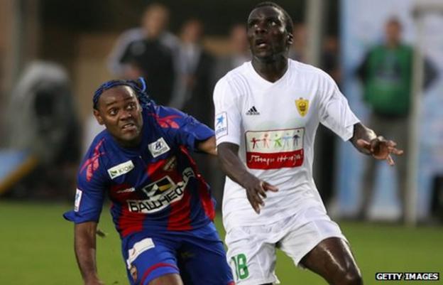 Benoit Angbwa (right) in action for Anzhi Makachkala