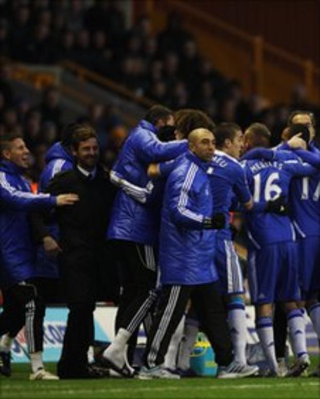 Chelsea players celebrate the opening goal at Wolves with their bench