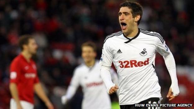 Danny Graham wheels away in delight after his long-range strike puts Swansea 2-1 up against Barnsley