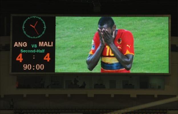 Angola's Zuela reacts with disbelief after teh final whistle in Luanda