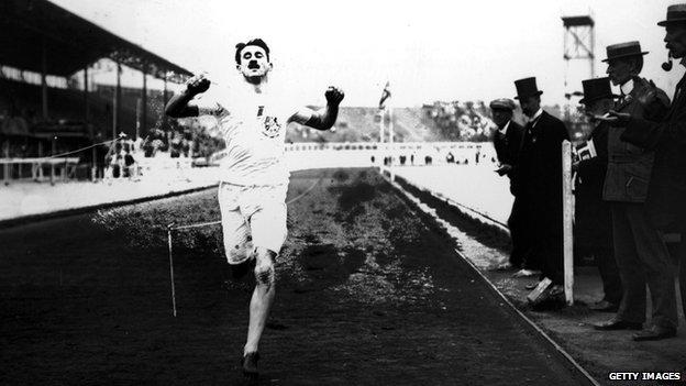 British athlete Wyndham Halswelle crosses the finishing line of the re-run Olympic 400m in 1908