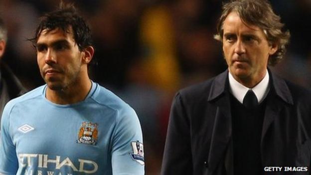 Manchester City striker Carlos Tevez and manager Roberto Mancini