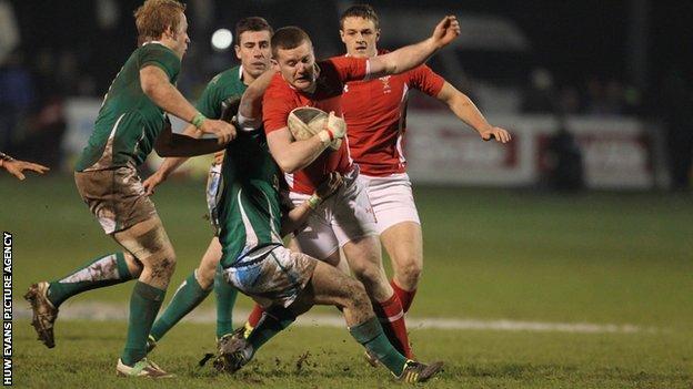 Wales' Iolo Evans is tackled by Kieron Marmion of Ireland