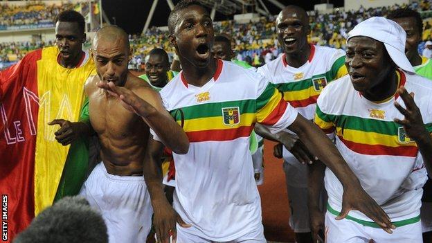 Mali players celebrate their penalty shoot-out win against Gabon