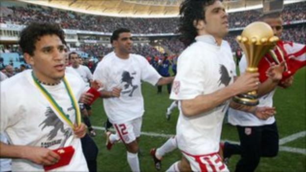 Tunisian players celebrate winning the trophy in 2004 at home after beating Morocco 2-1 in the final