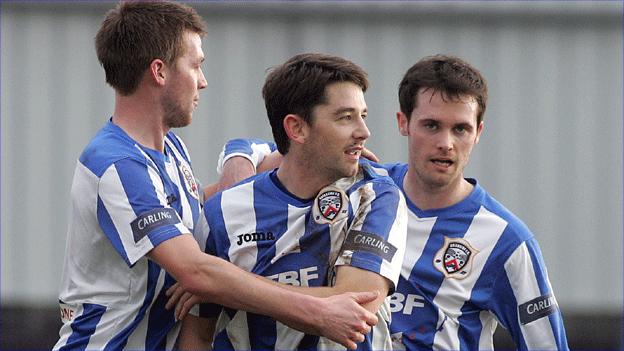 Curtis Allen is congratulated by his Coleraine team-mates
