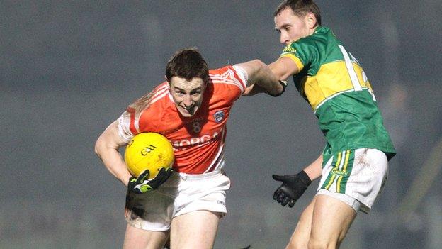 Armagh midfielder Malachy Machin is challenged by Kerry's Sean O'Sullivan