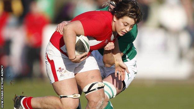 Lisa Newton of Wales is tackled by Siobhan Fleming of Ireland