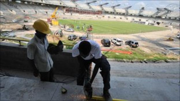 Workers inside Libreville's Stade Omnisport