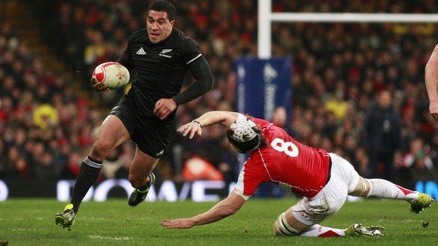 New Zealand's Mils Muliaina leaves Wales' Ryan Jones for dead in the 2010 clash in Cardiff