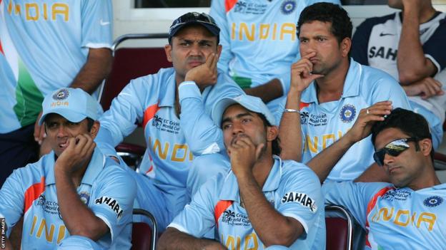 Rahul Dravid (far left) and India's players look on dejectedly as they go out of the 2007 World Cup